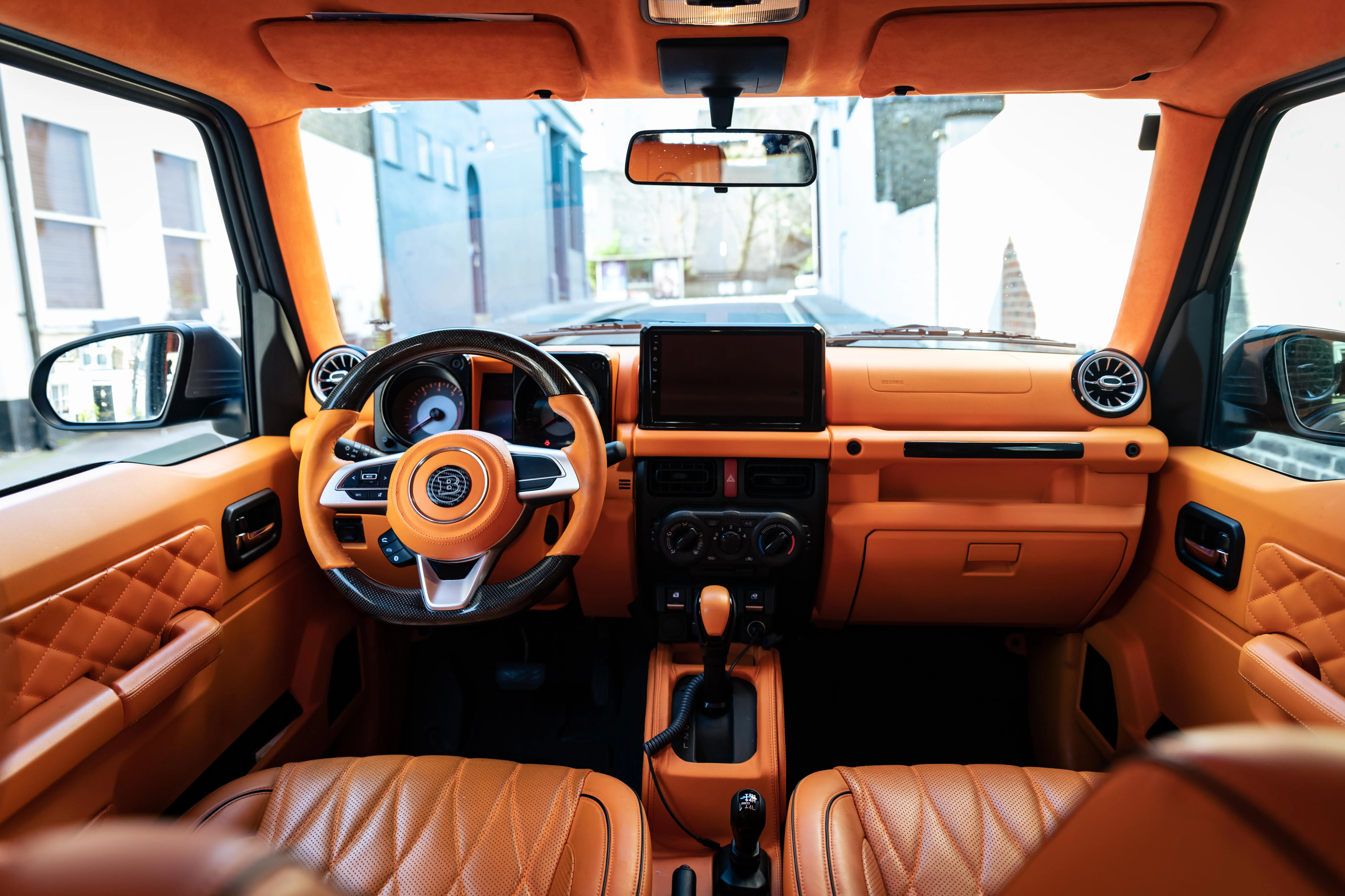Suzuki Jimny Brabus Orange Interior Dashview from Back Seat